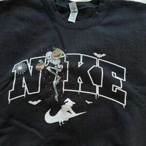 “Nike” Halloween pullover. Size larger. Worn a couple times. Purchased on Etsy